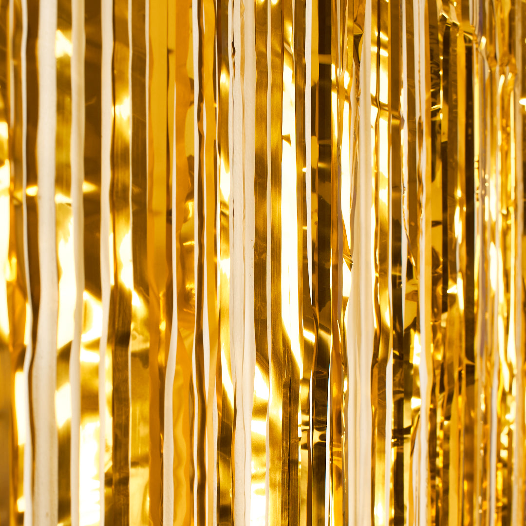 Guldfärgad glittergardin som fotobakgrund