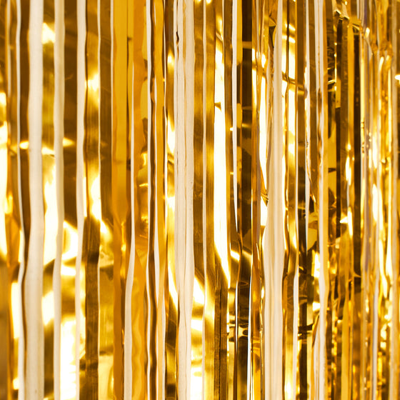 Guldfärgad glittergardin som fotobakgrund